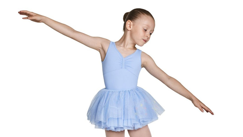 A young female ballet dancer wearing the Mirella embroidered mesh bodice tank tutu leotard in blue with tights