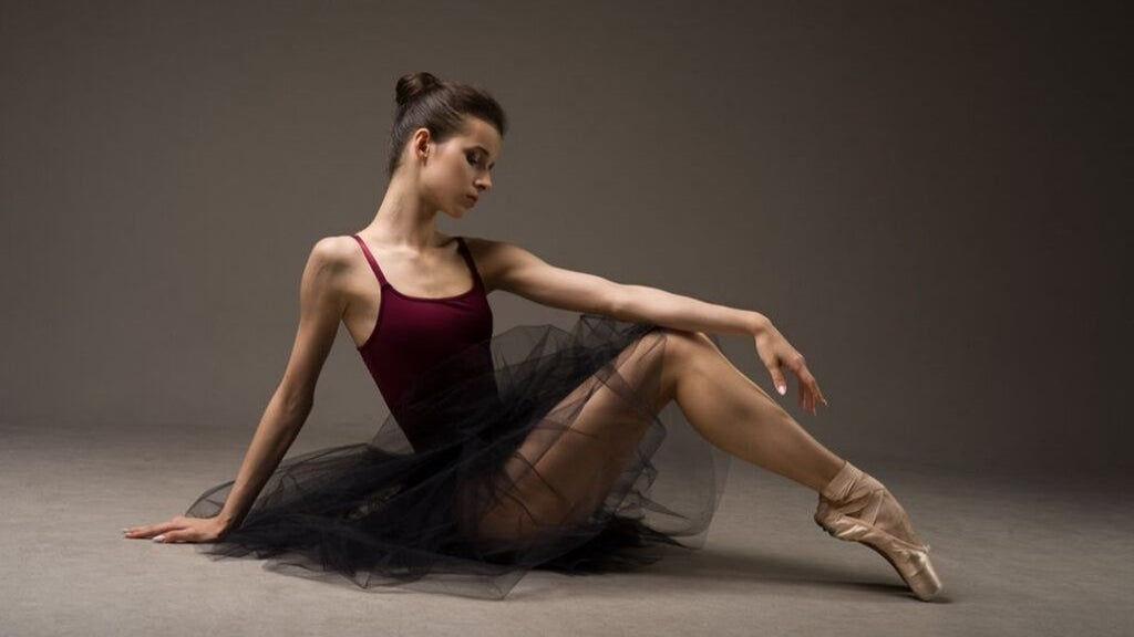 Ballet dancer Maria Khoreva wearing BLOCH leotard, tutu and Pointe Shoes in the studio 